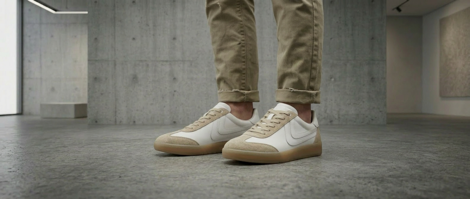 Place on a model wearing cool worn khakis that are slightly rolled with the same background in the photo.png