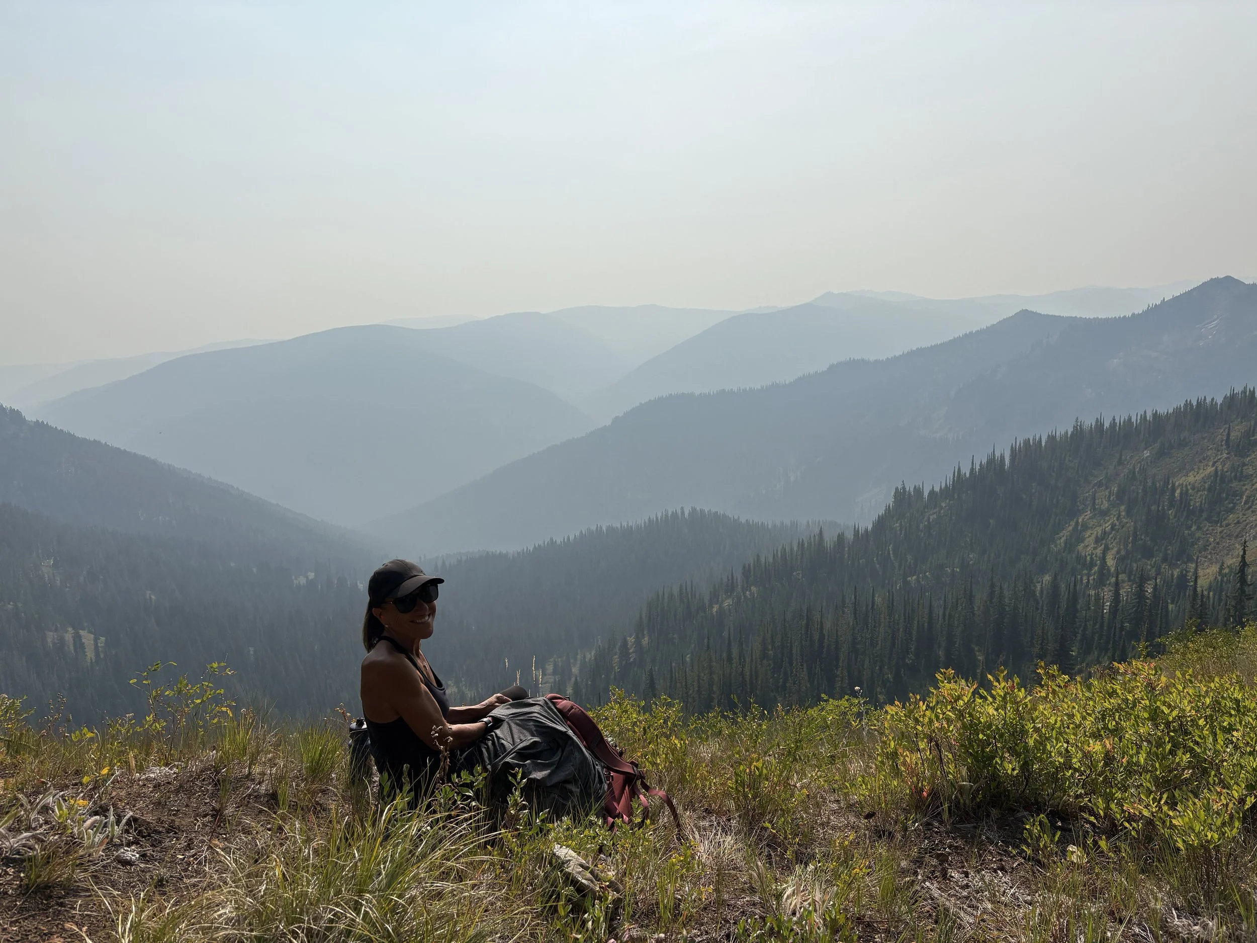 SchleyMountainTrailImprovement_TheRockyMountaineers_VolunteerWithMountainsInBackground_September2025.jpg