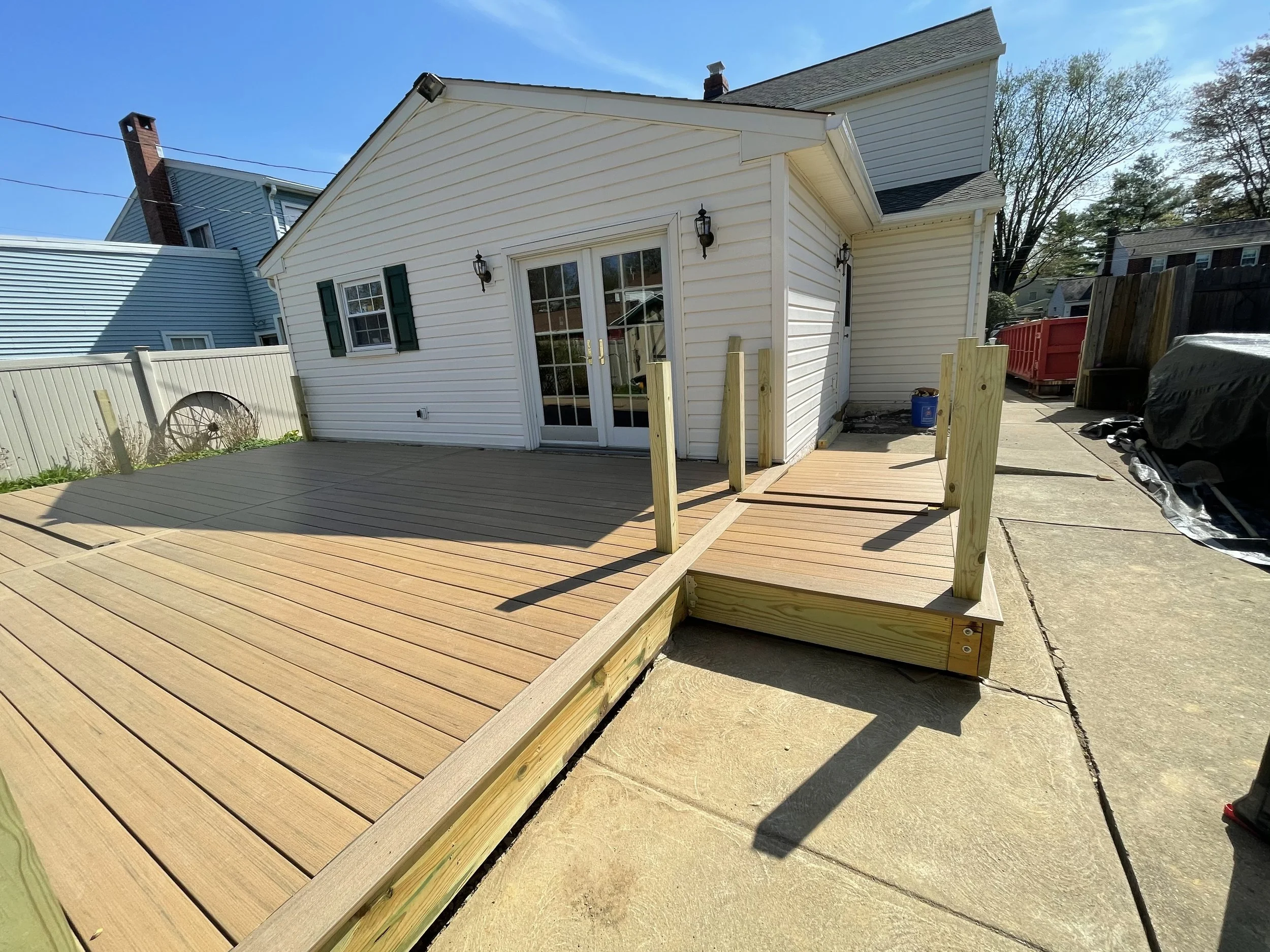 Composite decking installed over the completed framing before the railing and steps were finished.