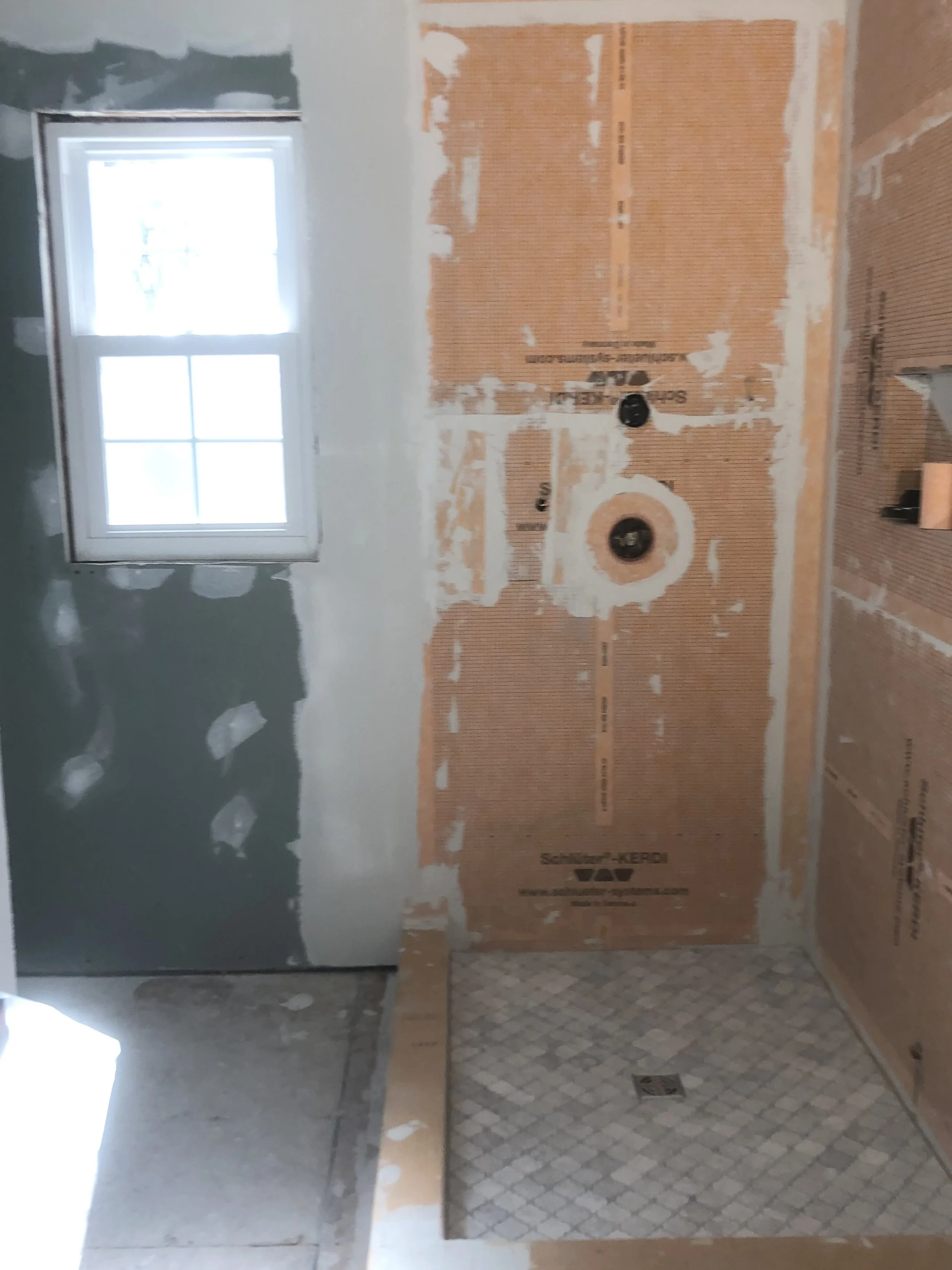 Walk-in shower in Upper Moreland, PA during waterproofing and preparation before tile installation.