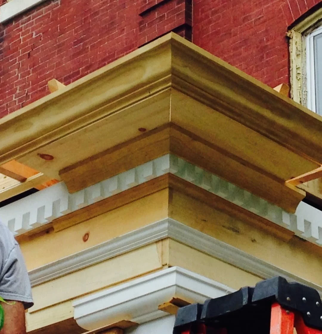 Close-up of rebuilt porch cornice and layered architectural trim during a JWD Contractors restoration project in Doylestown, PA.