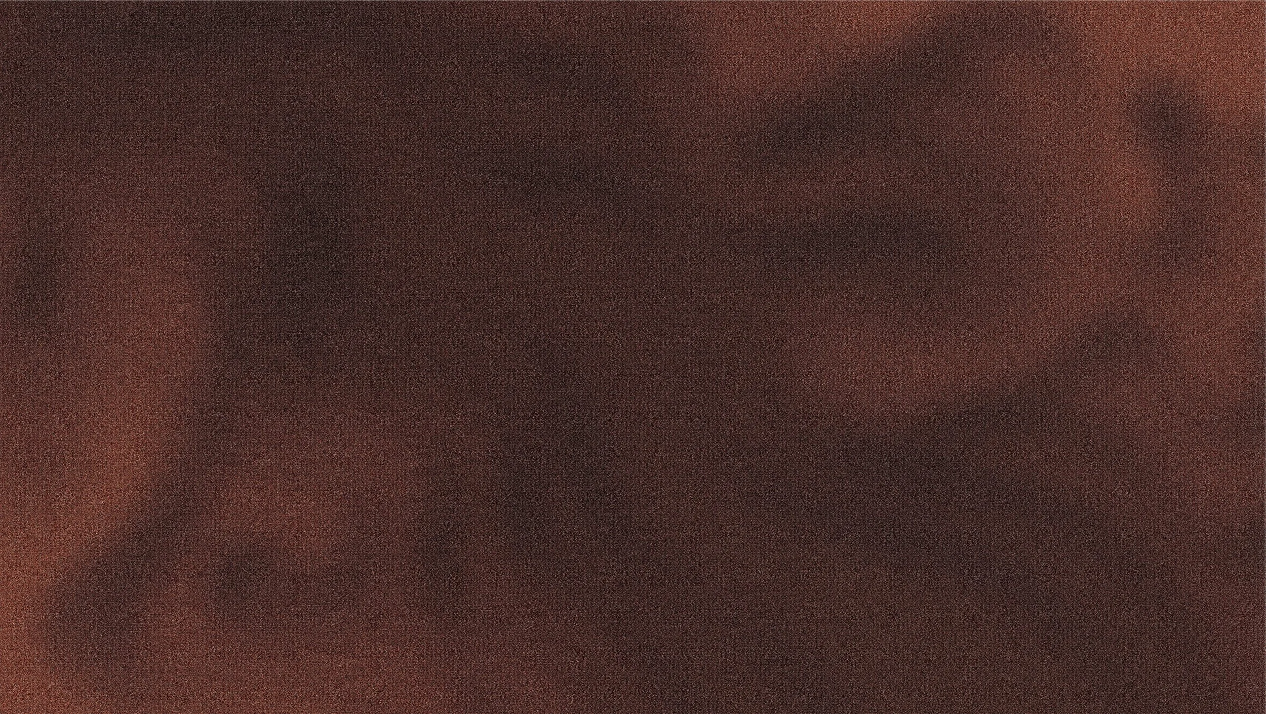Close-up of a person's face with dark skin, showing their eye and eyebrow.
