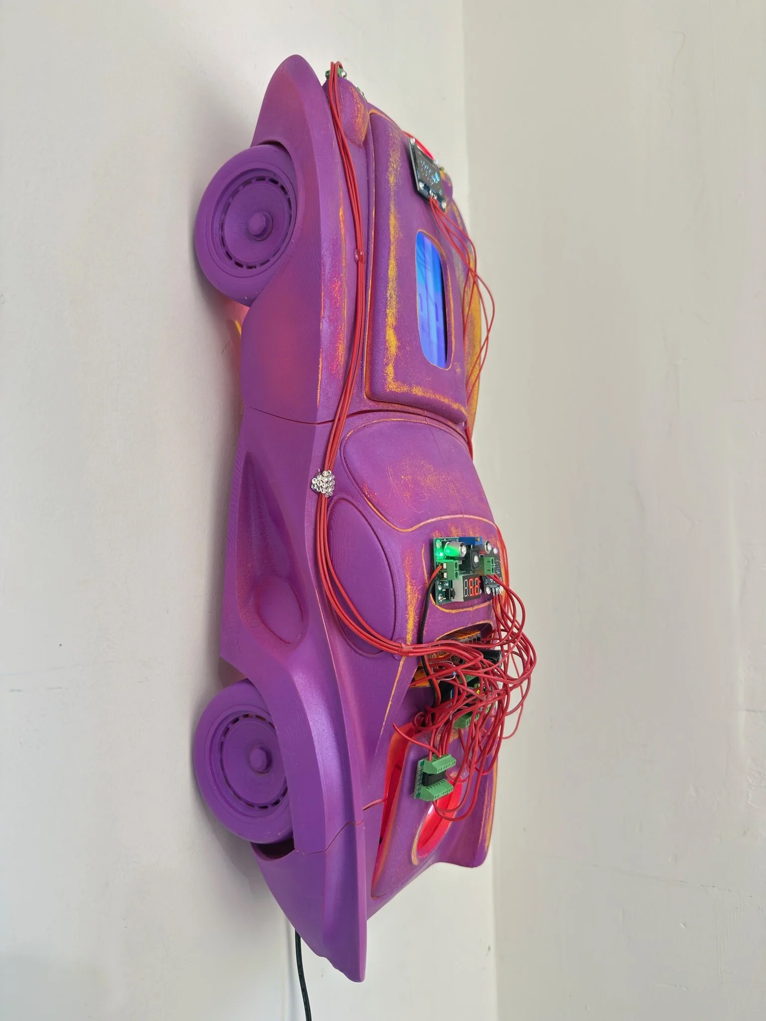 Dreaming car | 2026 | PLA, acrylic, Raspberry Pi, Arduino, LCD screen, OLED screen, voltage converter, LEDs, 3D animation loop | 24 x 10 x 7 inches | 3000USD