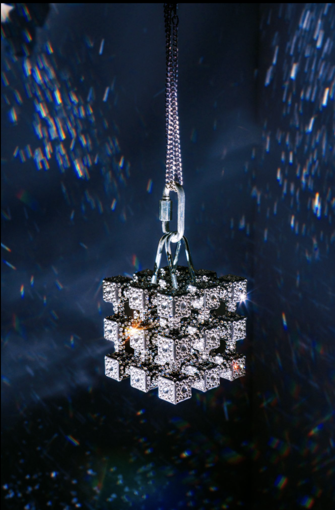 Volumetric Rhinestone Lattice #1 / Fractured Light Galaxy #1 | 
2025 | 
PLA, Preciosa Maxima rhinestones, chains, stepper motor, microcontroller | 
7 x 7 x 7 inches | 1600USD
