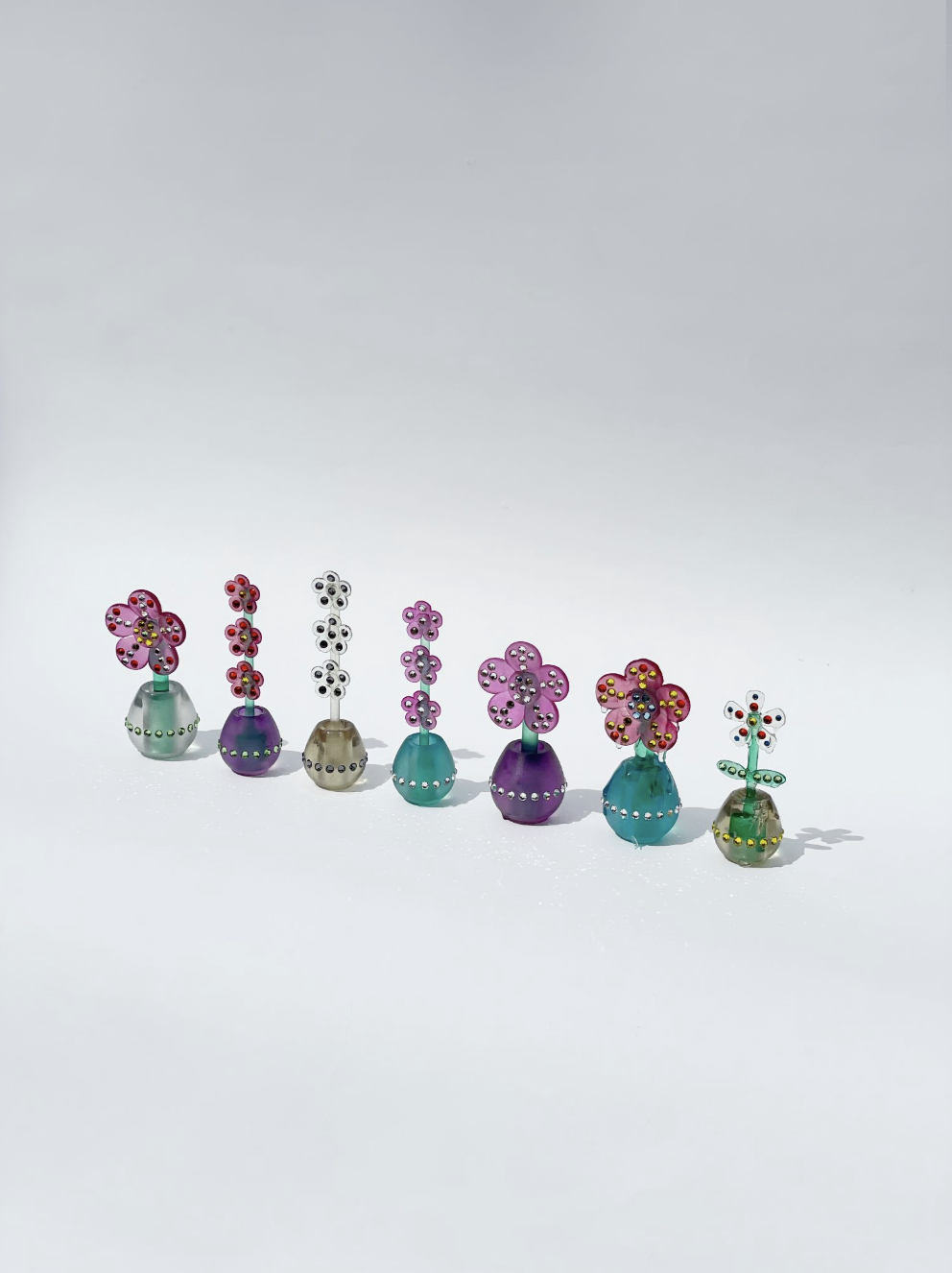 Floral Charms Series | 
2026 | 
Dimensions variable | 
Resin, metal-backed crystals, automotive paint