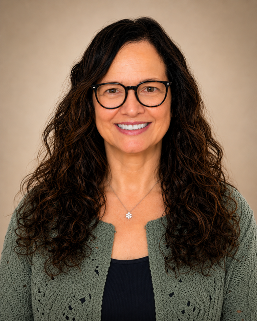 Headshot of Jody Kusheba APRN smiling wearing glasses with her hair down and wearing a knit sweater.