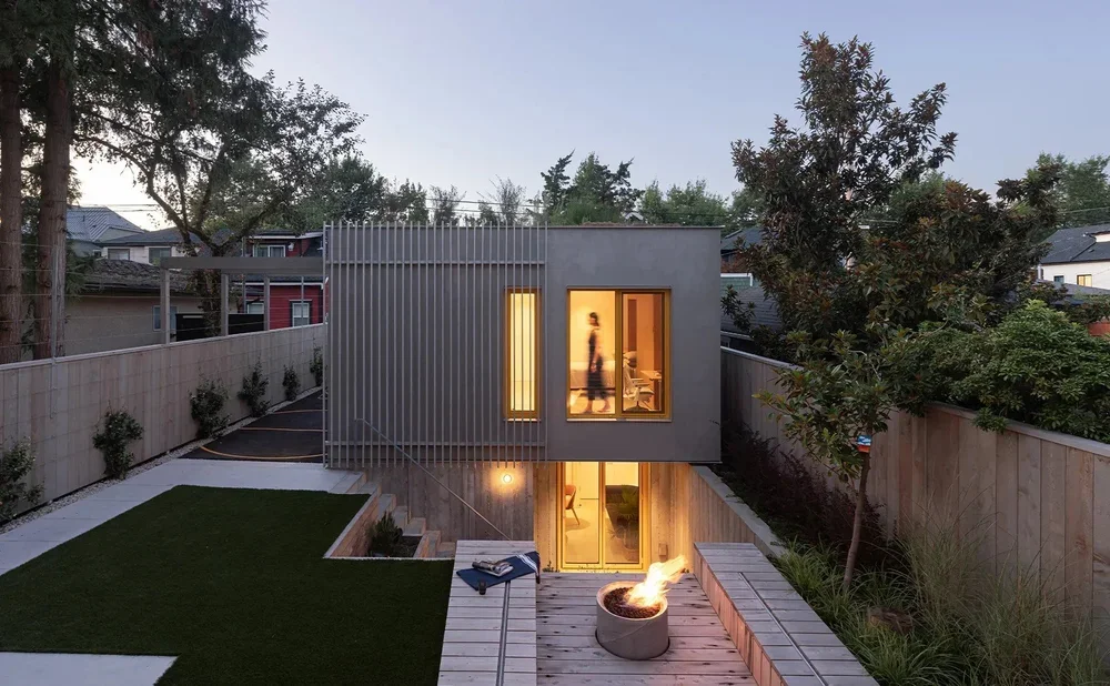 1808-FlexHouse-Exterior+Laneway+night.webp