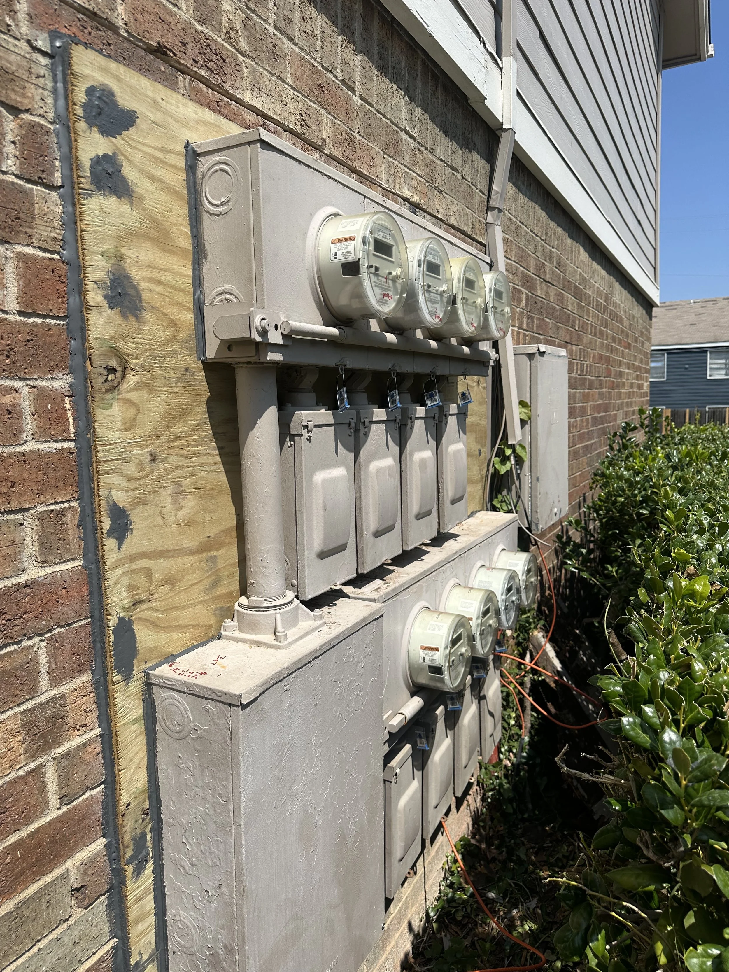 Multi-unit electrical meter installation in Dallas–Fort Worth with multiple meters, disconnects, and service panels by licensed electrician