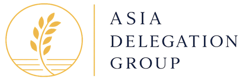 Logo for Asia Delegation Group featuring a gold laurel branch inside a gold circle and the text 'Asia Delegation Group'.