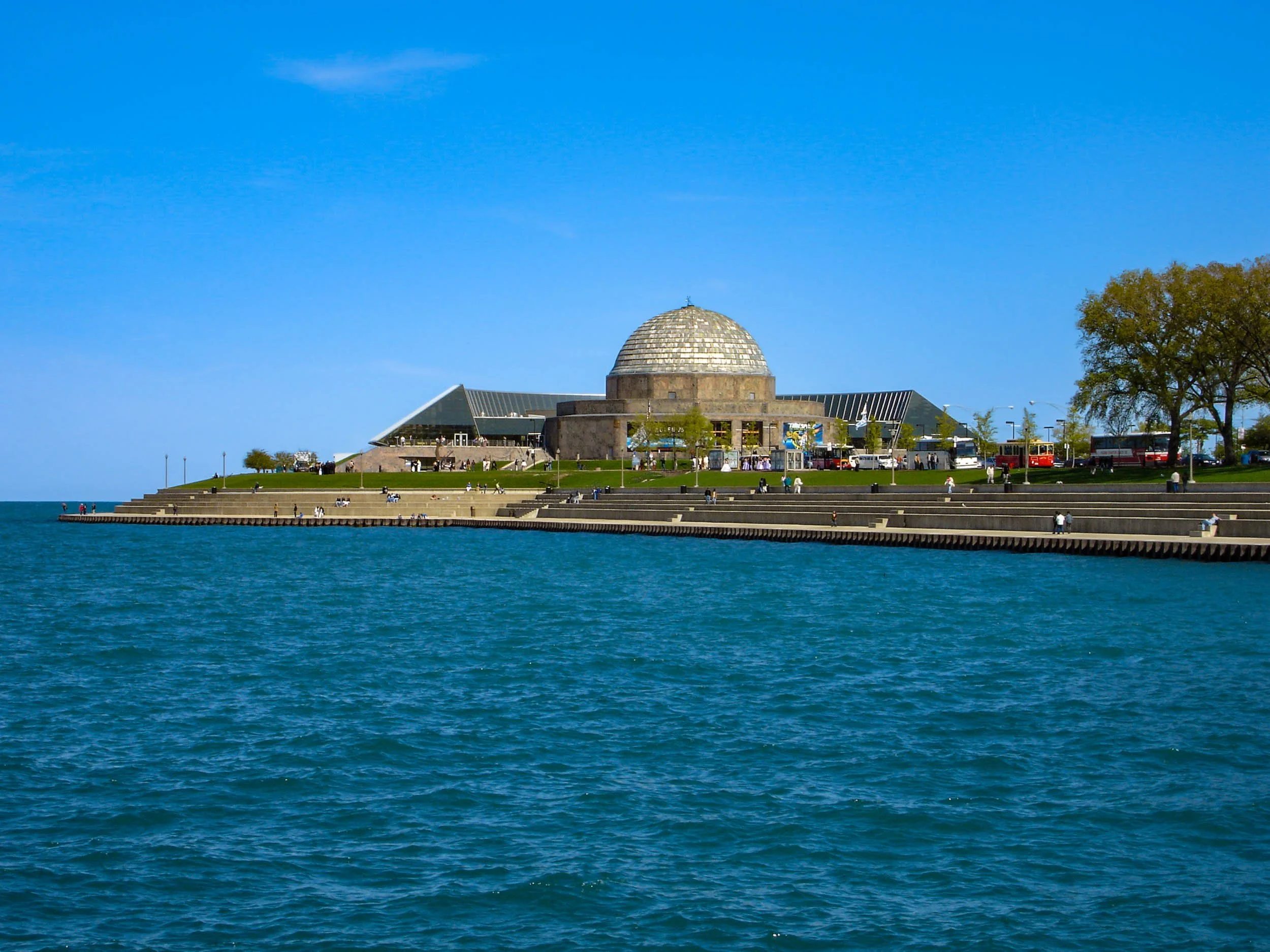 The Adler Plantarium at the far end of Northerly Island that is part of Museum Campus. Founded in 1930, it was America's first planetarium and a premier space science center, featuring immersive dome theaters, historic astronomical instruments, and i