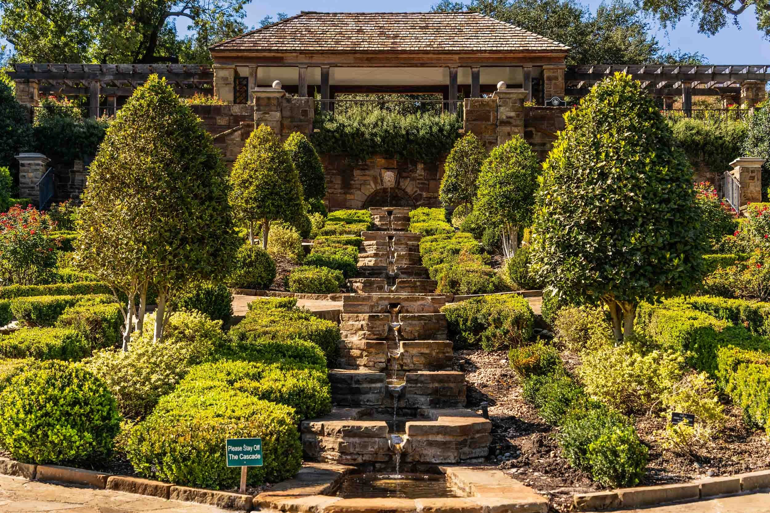 This stunning backdrop at the Fort Worth Botanic Garden is often used as a wedding venue with the bride and groom exchanging vows in front of the lush terraced planted area which has a small cascading waterfall running through a series of small terra