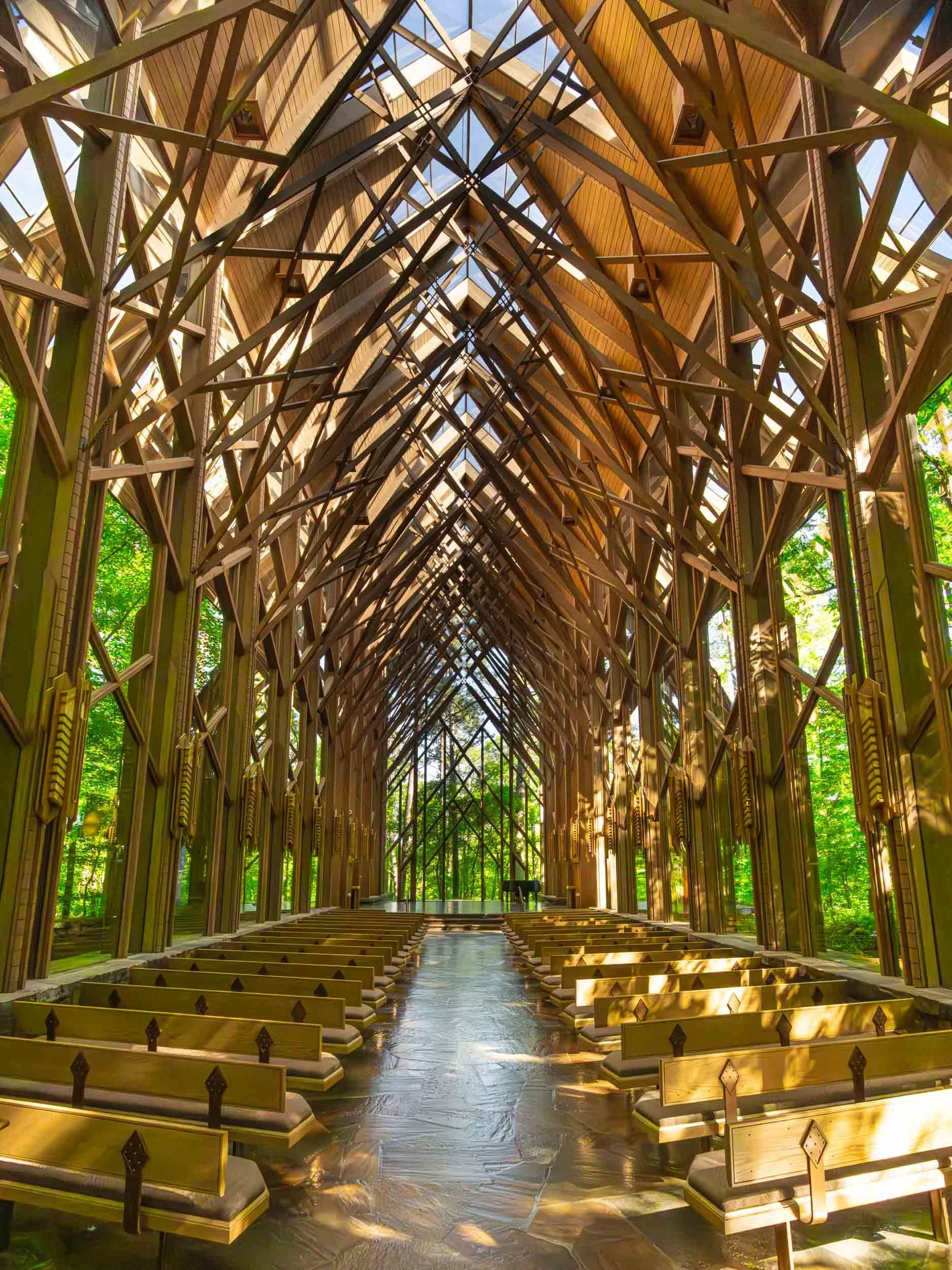 Stunning floor-to-ceiling glass walls and skylights provide panoramic views of the surrounding woodland, with natural light creating a "cathedral of nature” that brings the forest inside.