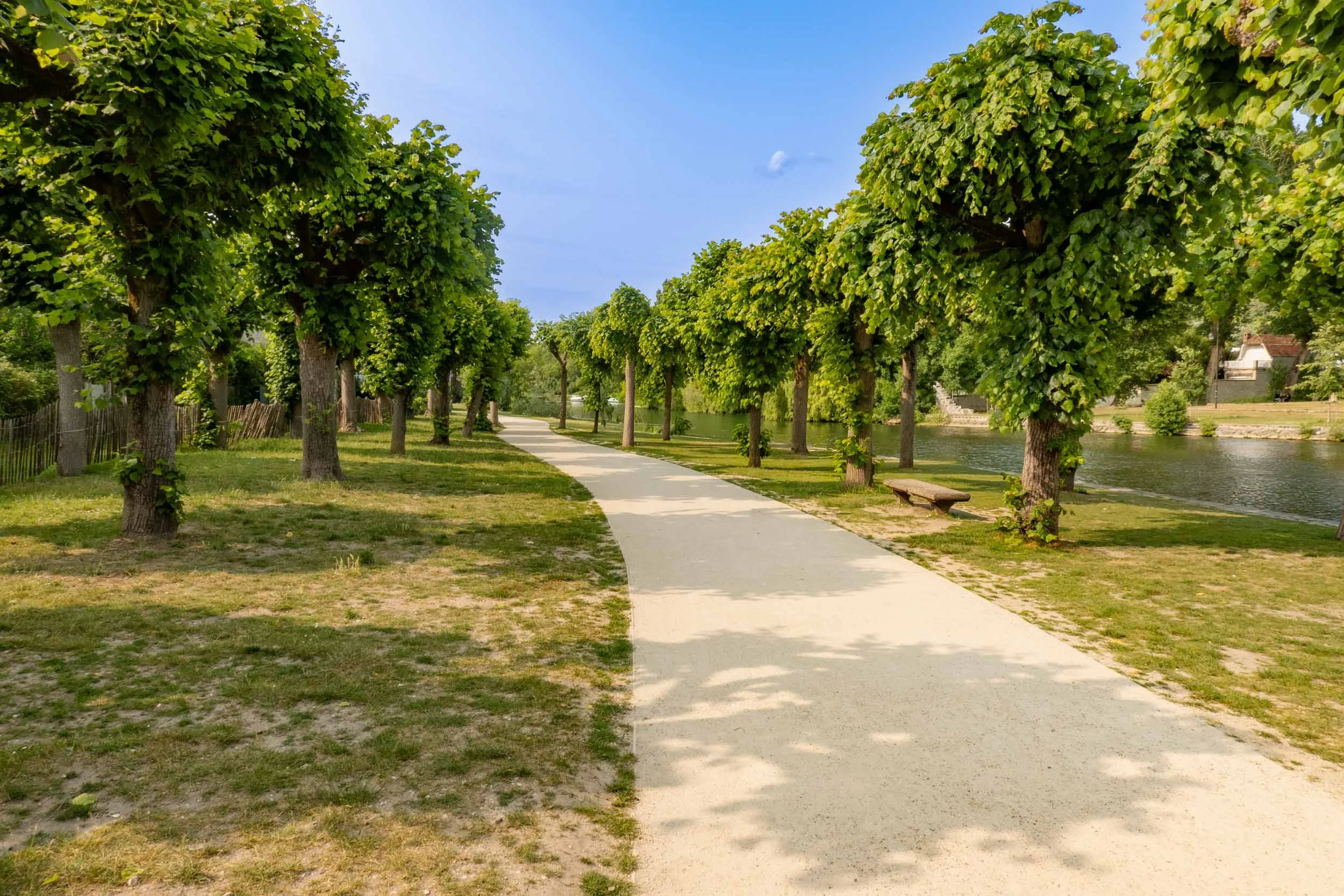 A peaceful path that leads from the medieval town of Moret-sur-Loing in France and runs by the Loing River, a tributary of the Siene River.