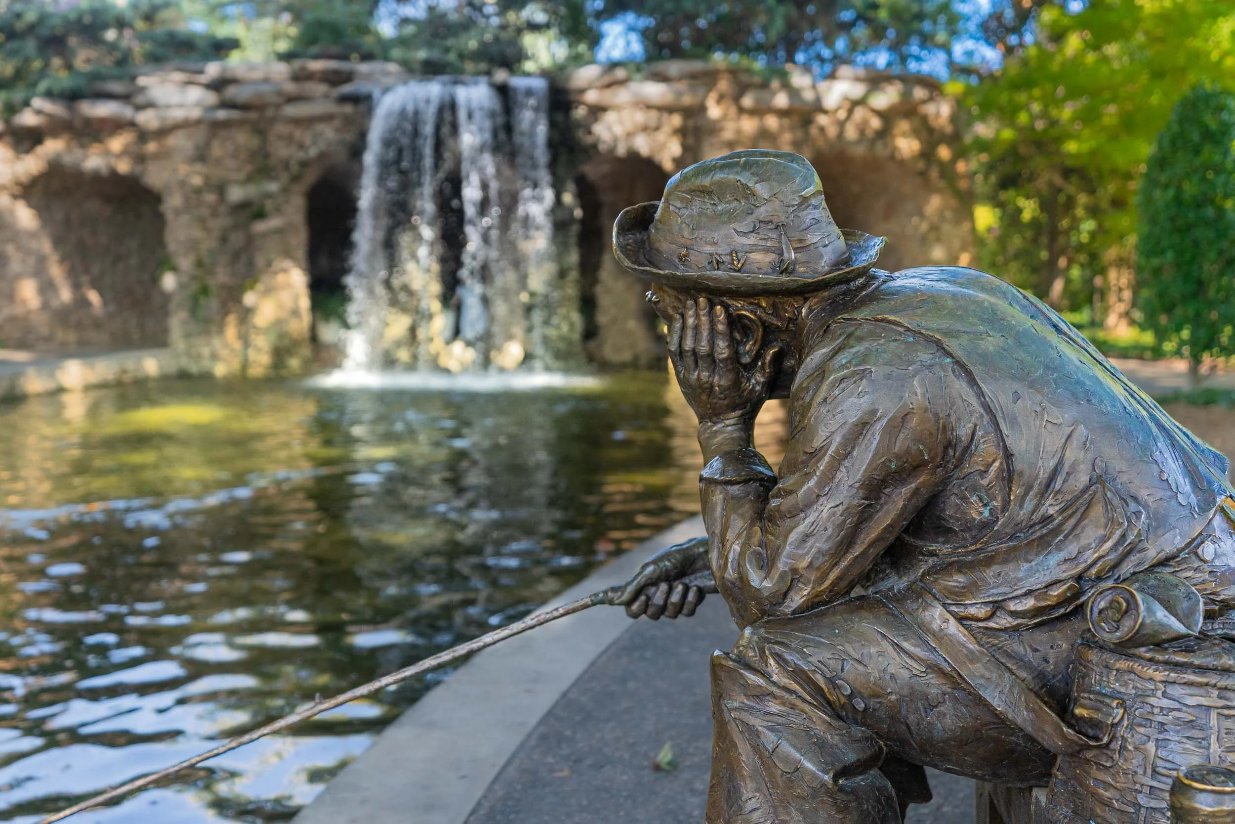 On permanent display at the Dallas Arboretum is a bronze sculpture called "Old Man Fishing," It is by American sculptor Gary Price, whose sculptures are collected and installed all over the world. The images which follow are of sculptures from a Gary