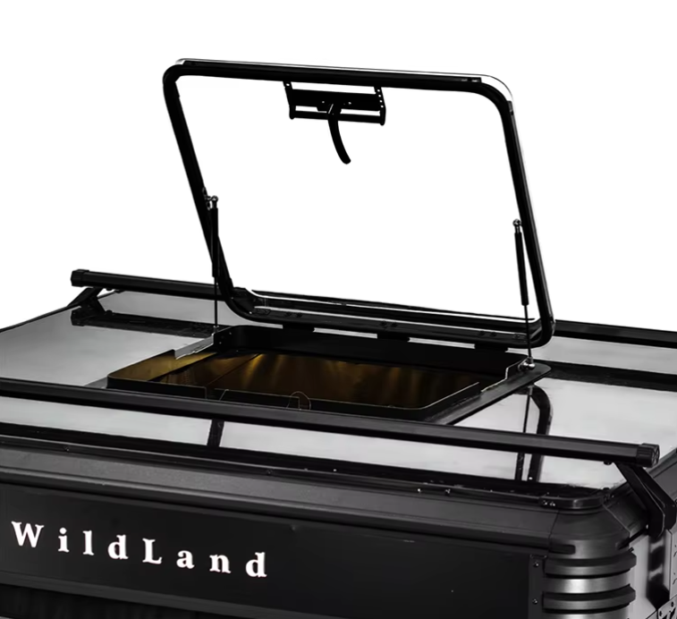 Open hatch on a black and white Wildland fire truck or emergency vehicle