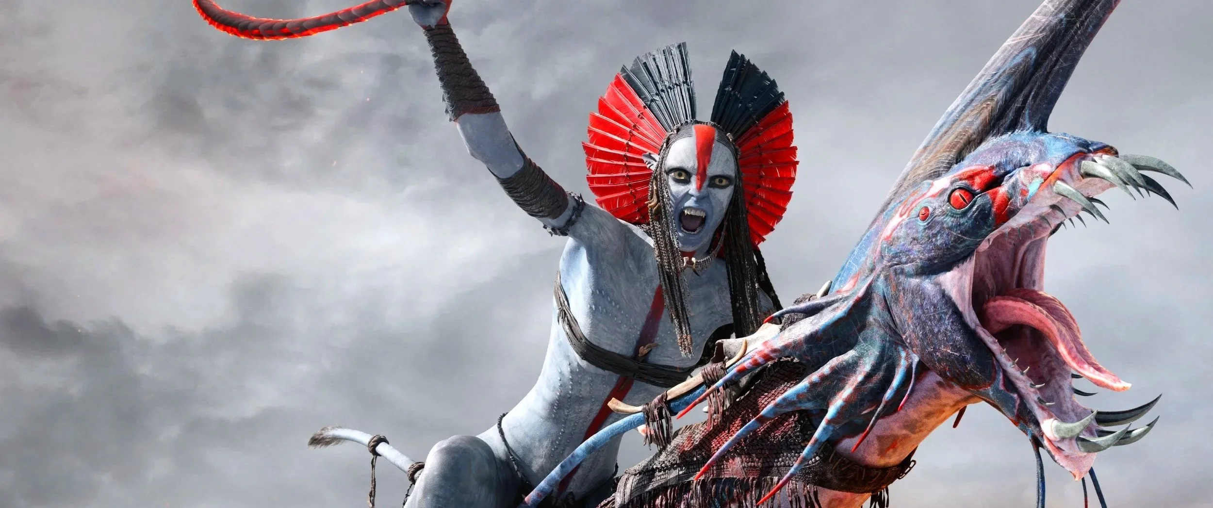 A person with blue skin, black and red face paint, and wearing a headdress rides a giant, fantastical whale-like creature with a fierce, open mouth and sharp teeth, against a cloudy sky background.