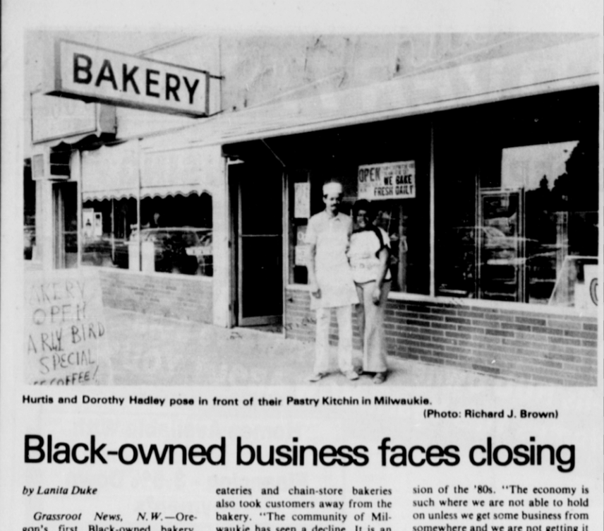 Black and white newspaper article featuring a horizontal photograph. Title of article "Black-owned business faces closure." Image depicts large windows and brick of the storefront of the Milwaukie Pastry Kitchen. 