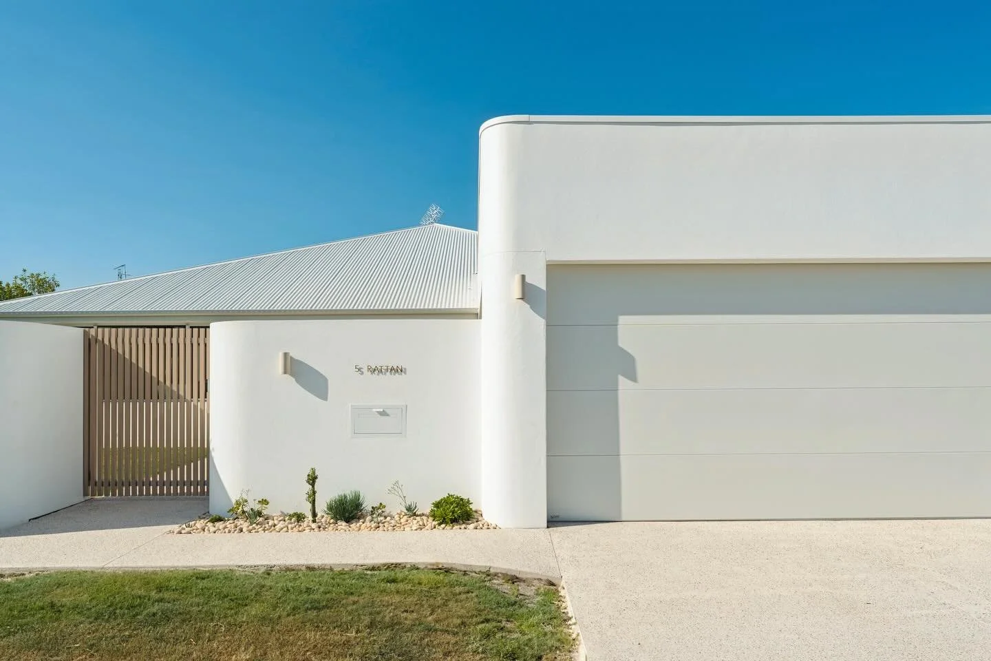Curved walls and raked ceilings, showcasing modern design, smooth finishes and a welcoming style 😍