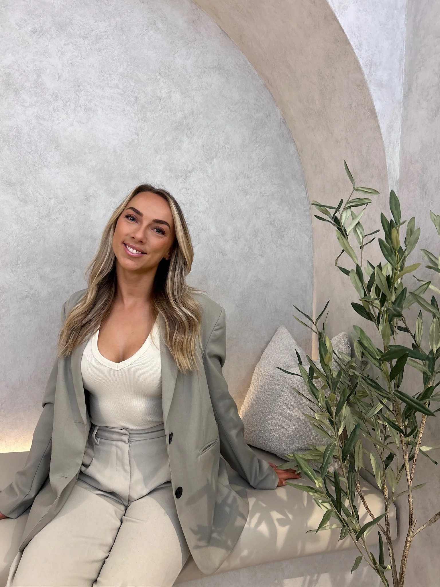 Ashlea Baldwin sitting on seat in new studio, JC Body Boutique
