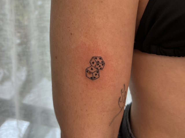 two rolling dice on arm by banksia and blade