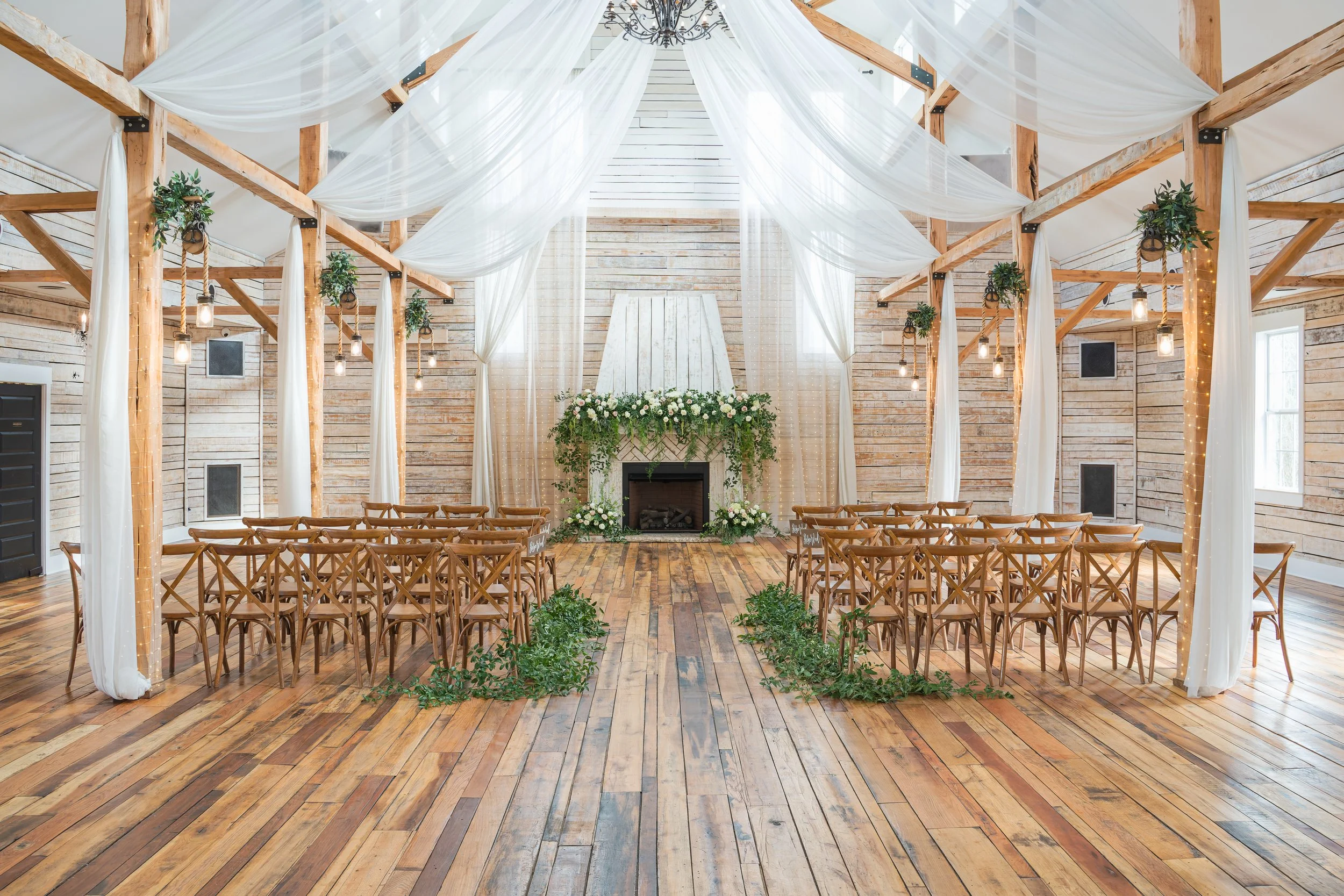 Lush, green indoor wedding ceremony at Ramble Creek all-inclusive wedding venue in East Tennessee with airy natural vibes