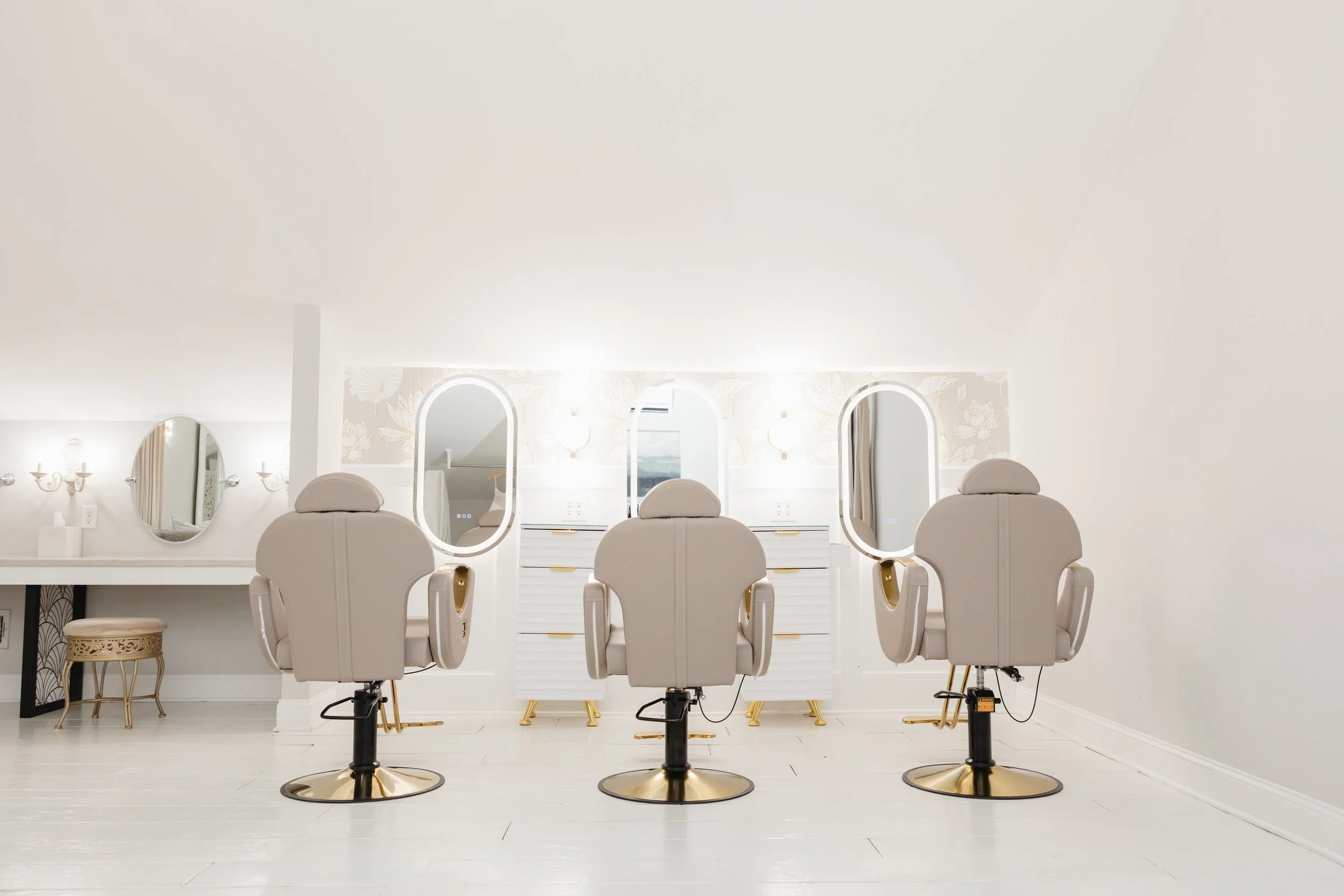 Bright bridal hair and makeup suite at Ramble Creek Wedding Venue in Athens, Tennessee, featuring salon chairs, illuminated mirrors, and dedicated onsite styling stations for the bride and wedding party.