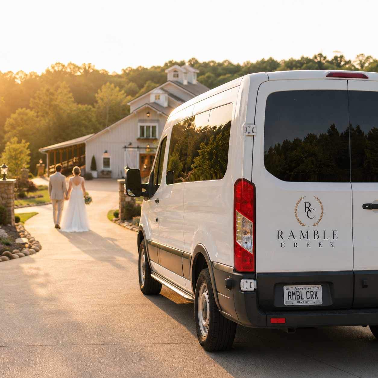 White Ramble Creek guest shuttle van parked along the venue driveway at sunset as a bride and groom walk toward the reception, highlighting wedding transportation services at Ramble Creek wedding venue in Tennessee