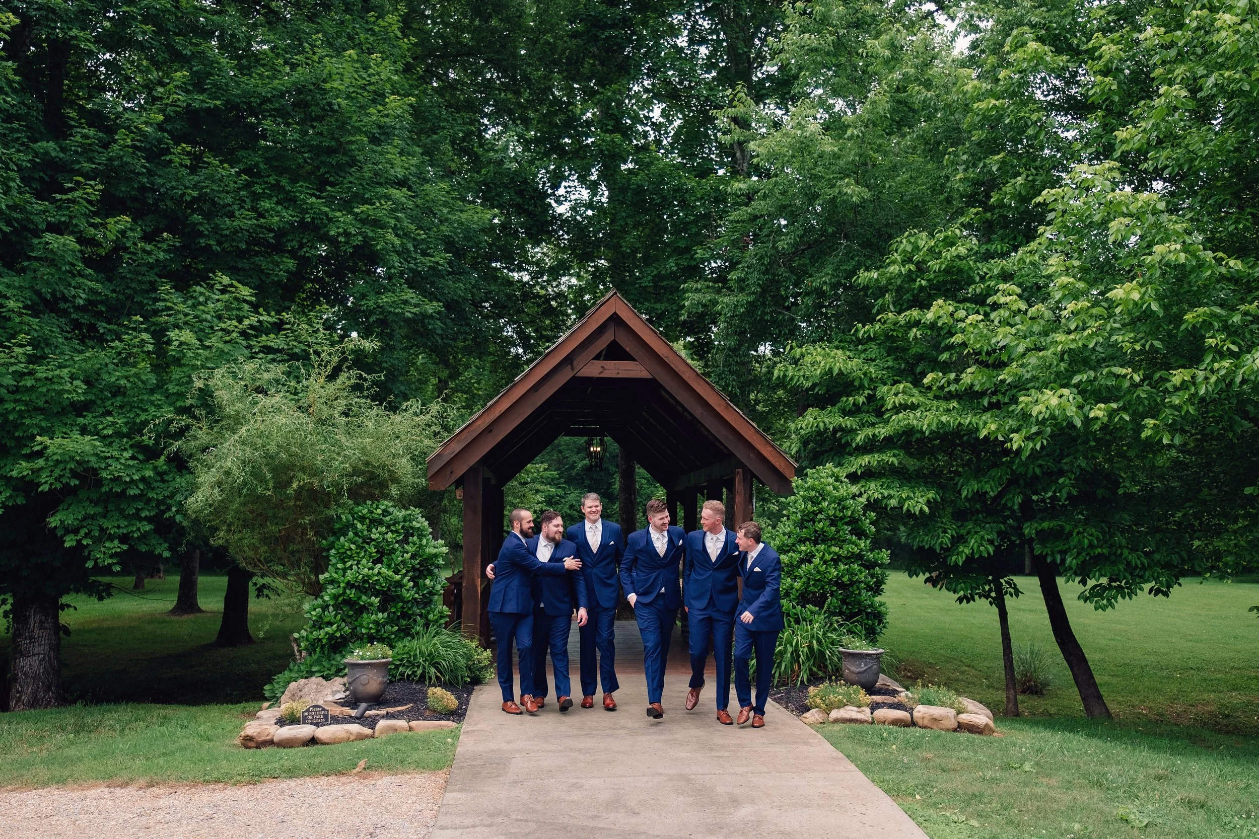 groomsmen-covered-bridge-may-spring-wedding.jpg