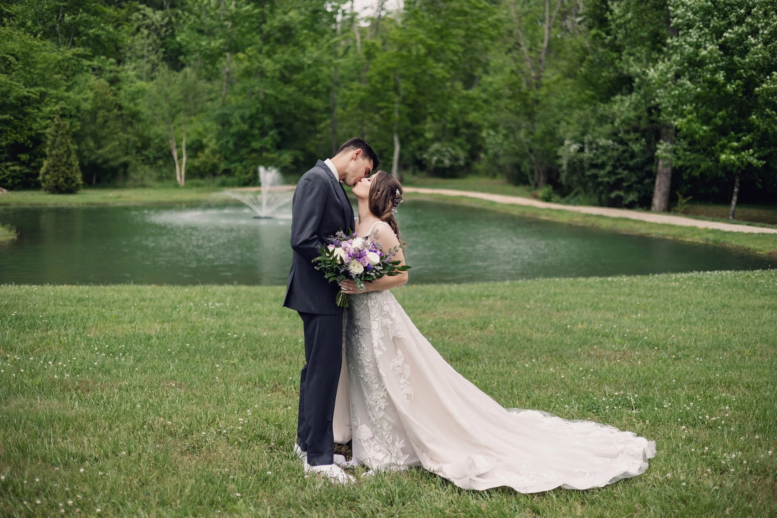 april-wedding-kiss-by-pond.jpg