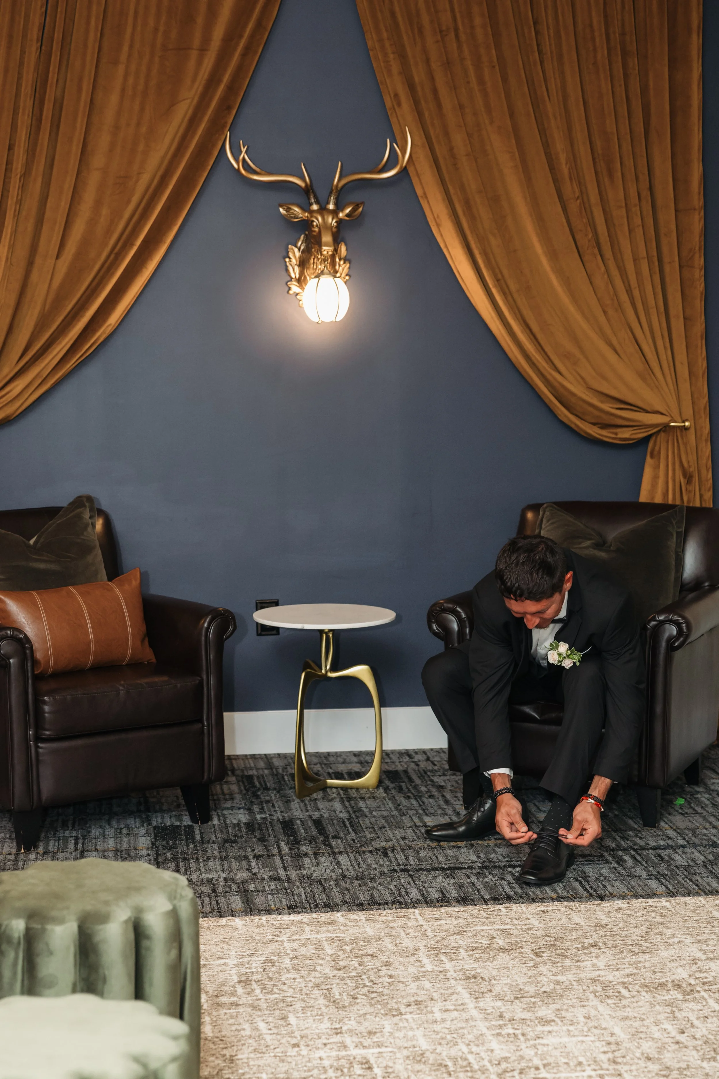 ramble-creek-grooms-quarters-groom-tying-dress-shoe-athens-tn-14.jpg