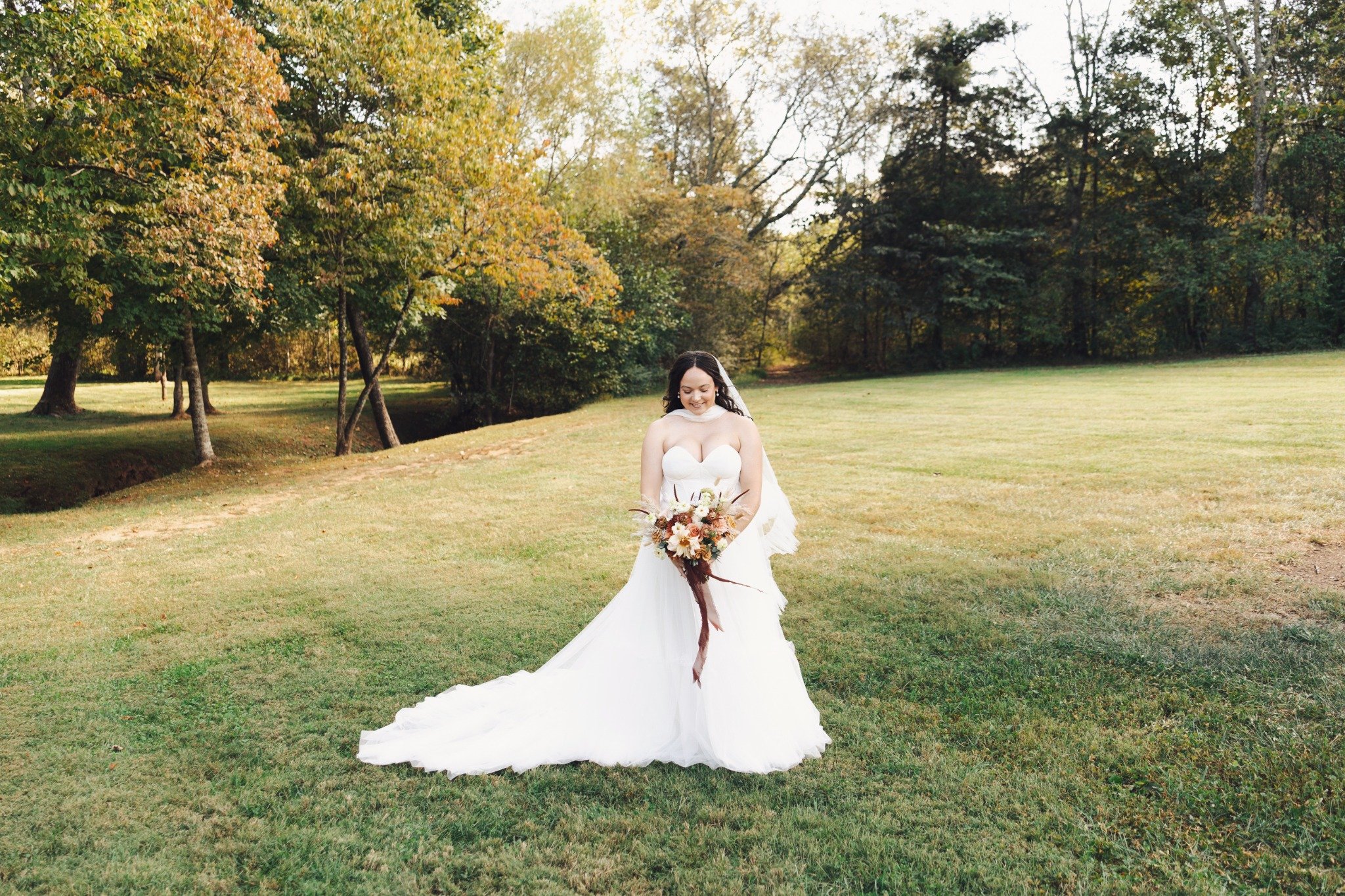 ramble-creek-fall-wedding-bride-portrait-lawn.jpg