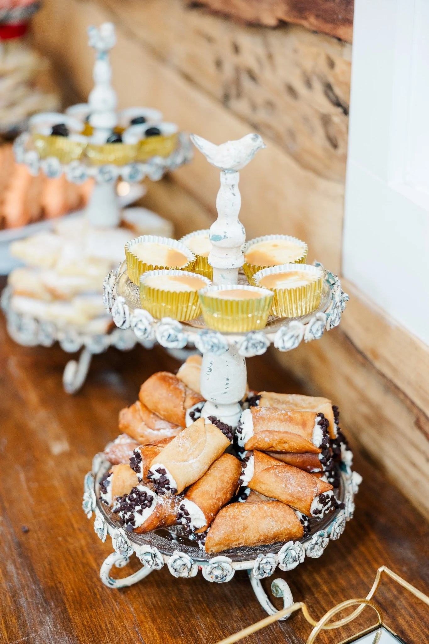 Dessert display with cannoli and mini cheesecakes served at a Ramble Creek wedding reception.