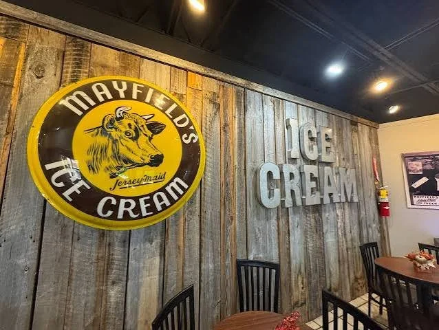 Pull up a chair at the Mayfield Dairy Visitor Center in Athens, where vintage signs and weathered wood set the scene for an ice cream stop in the town where Mayfield began.