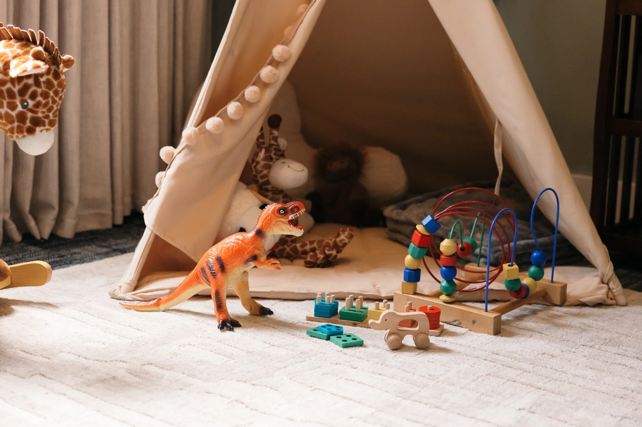 Teepee play space with children’s toys inside the Ramble Creek nursery for family-friendly weddings at a Tennessee wedding venue.