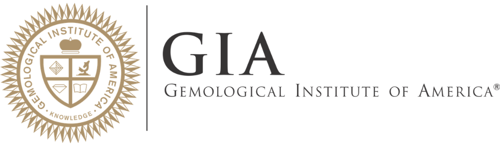Logo of the Gemological Institute of America featuring a gold and black emblem with a shield divided into four sections and the organization's acronym GIA