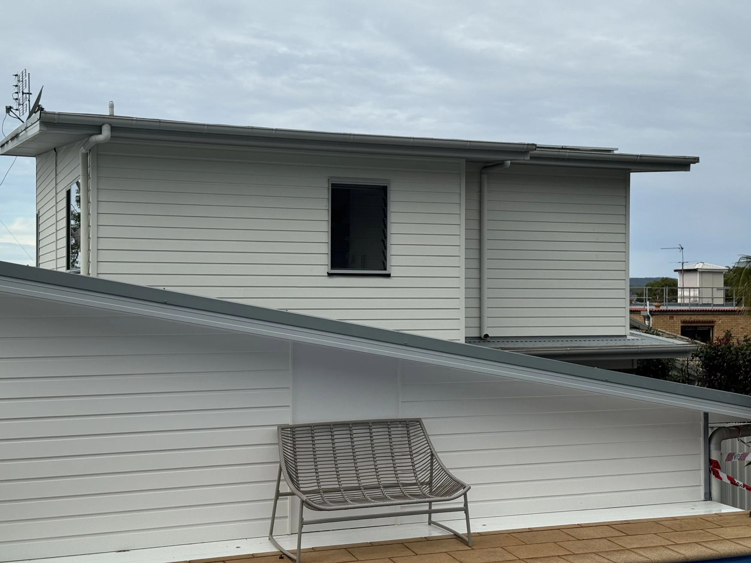 Exterior house repaint in Lake Macquarie featuring updated colours and refreshed weatherboard finishes.