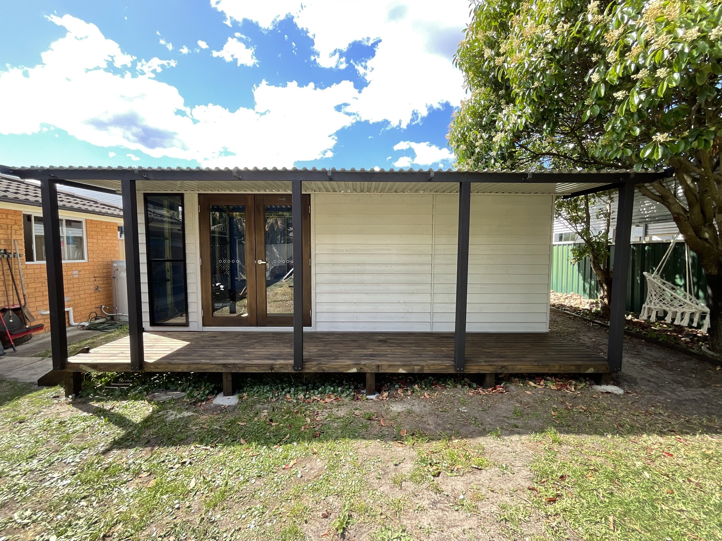 Timber decking restored and re-stained to protect against the elements and enhance the outdoor workspace appearance