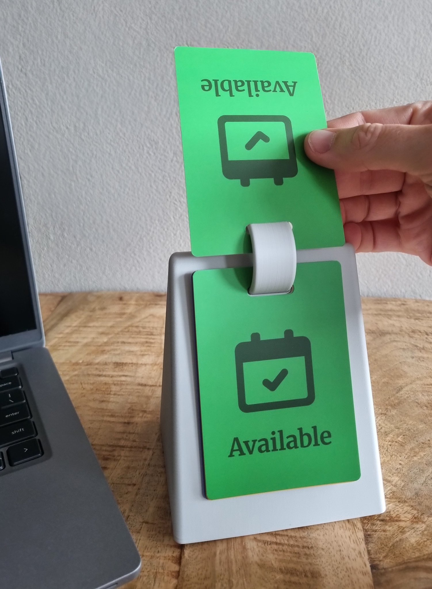 SocialFlip showing Available status on a desk.