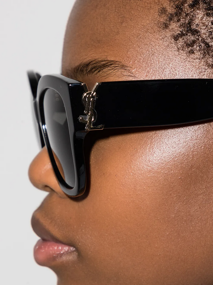 Side profile of model wearing Saint Laurent sunglasses