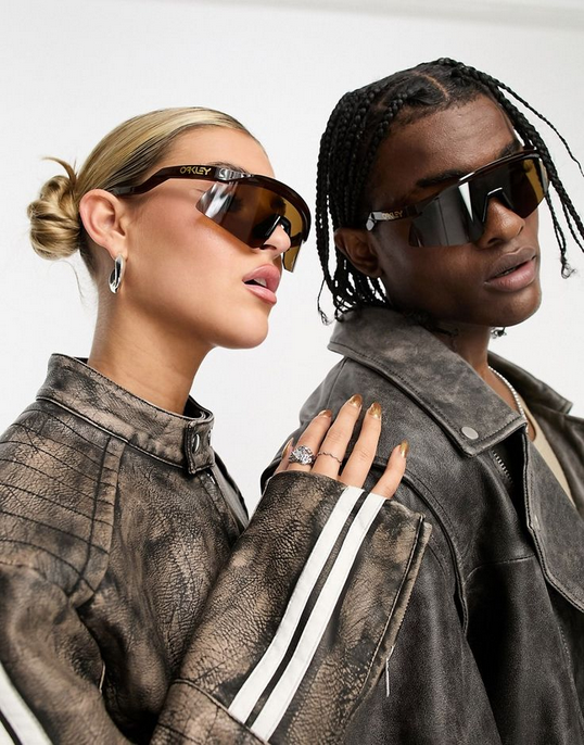 Two models wearing Oakley sunglasses