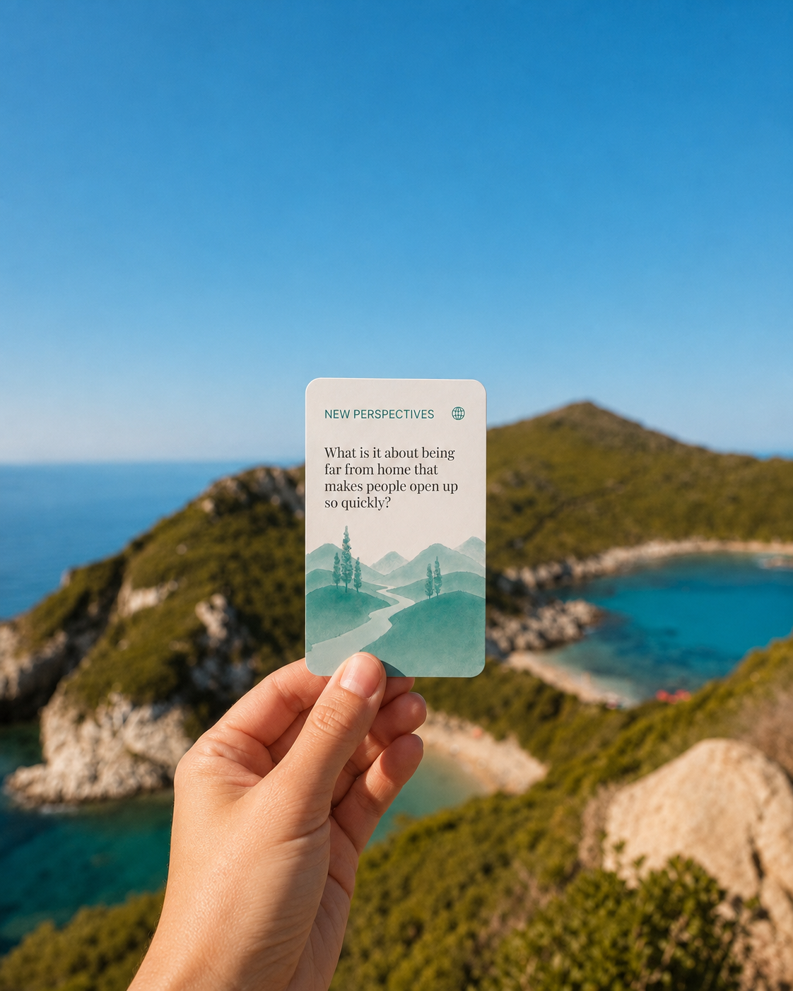 Far From Home card reading "What is it about being far from home that makes people open up so quickly?" held up against a coastal view.