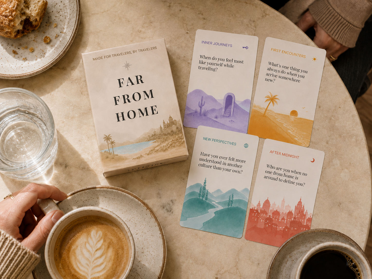 Far From Home conversation card deck on a café table with coffee, alongside four illustrated question cards.