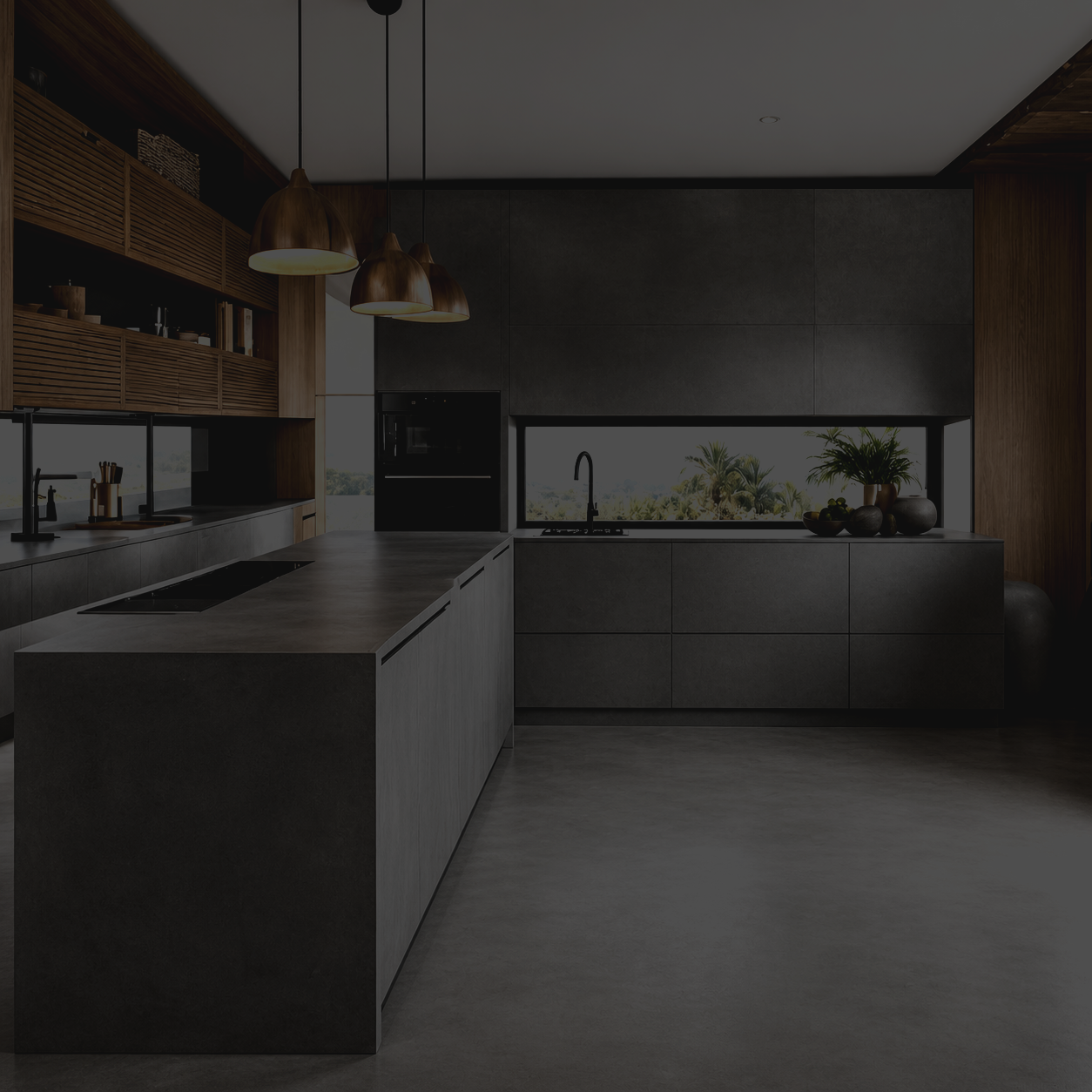 Modern kitchen with dark cabinets, concrete countertops, pendant lights, and a large window showing palm trees outside.