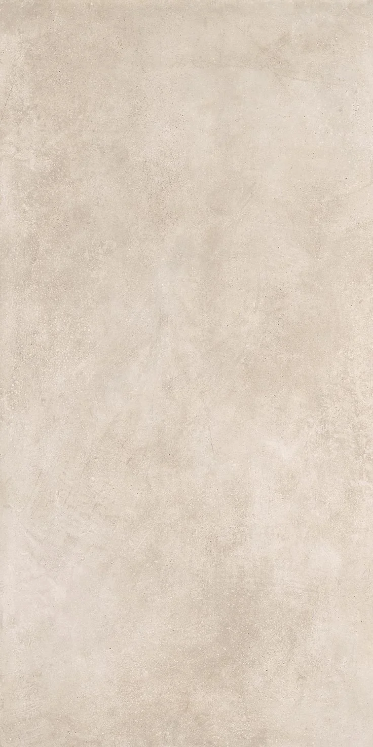 A neutral beige concrete wall background.