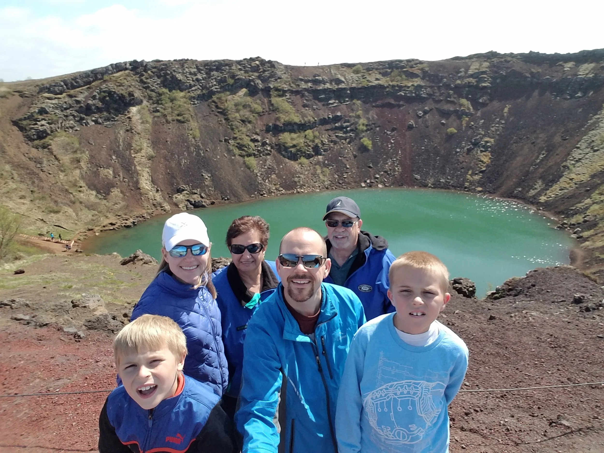 Multi-gen family isiting Kerid Crater in Iceland on the Golden Circle