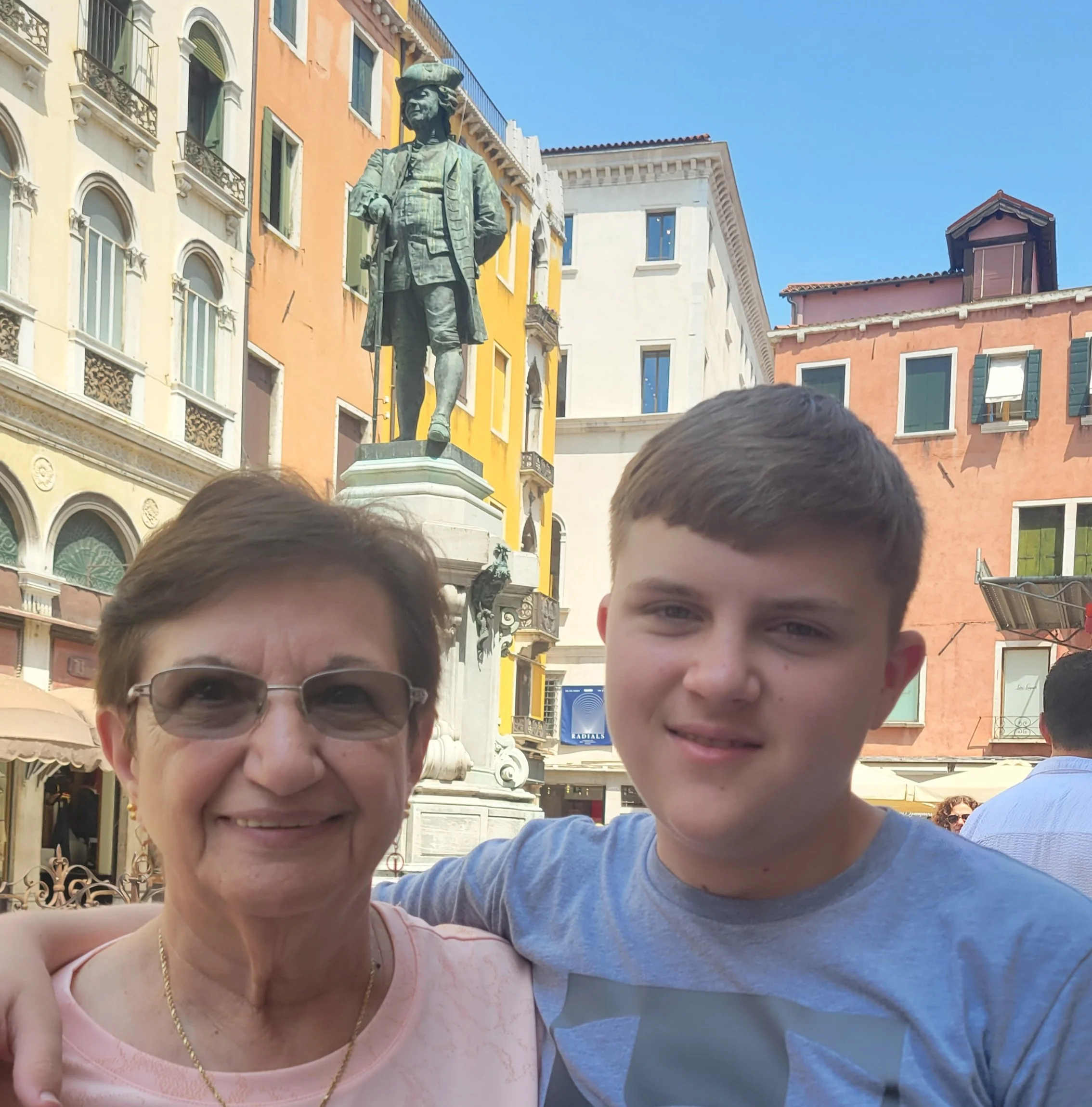 A happy grandmother and grandchild enjoying quality time together during a multi-generational family vacation.