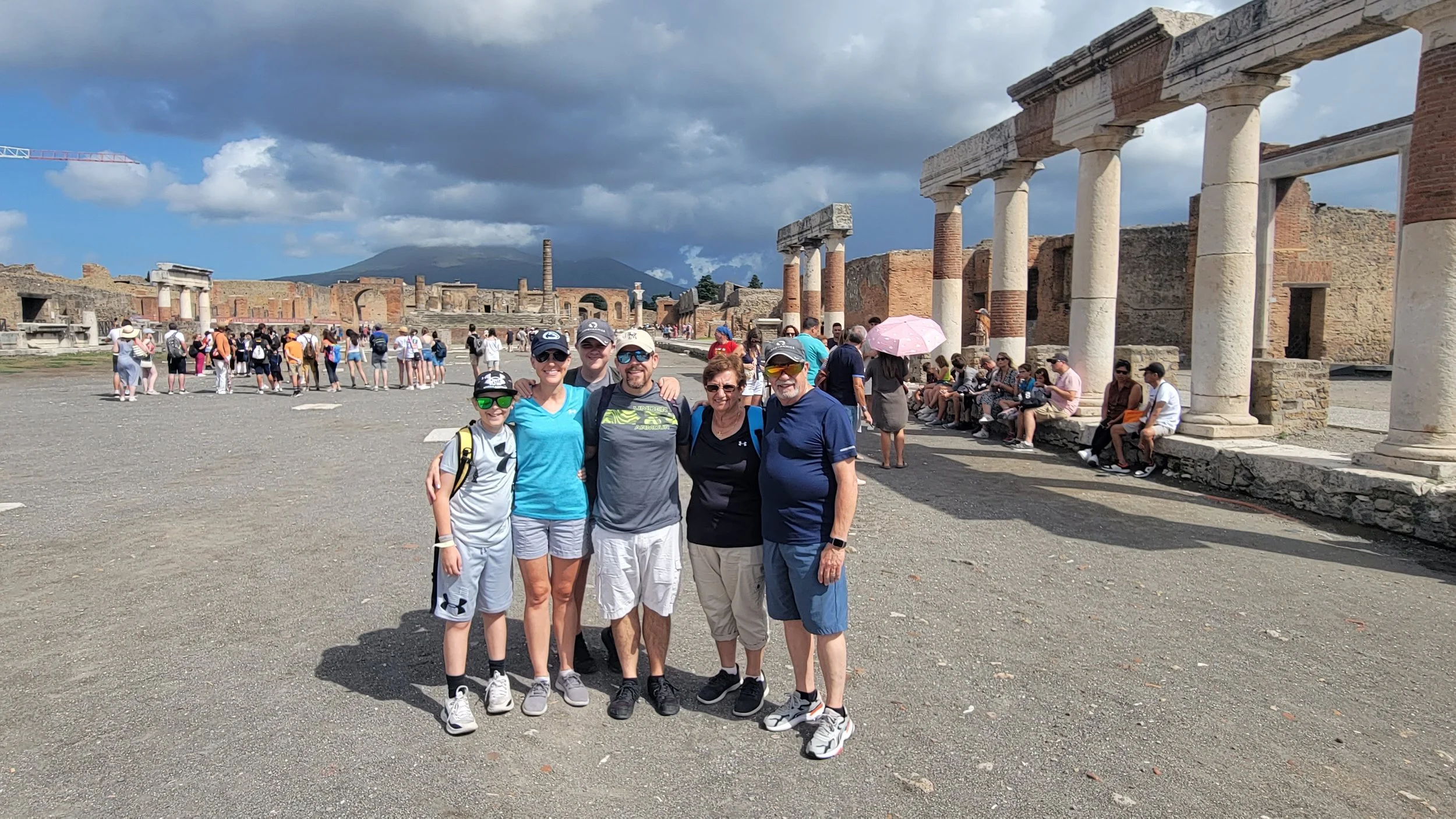 Multi-generational family of 6 posing in Pompeii, Italy