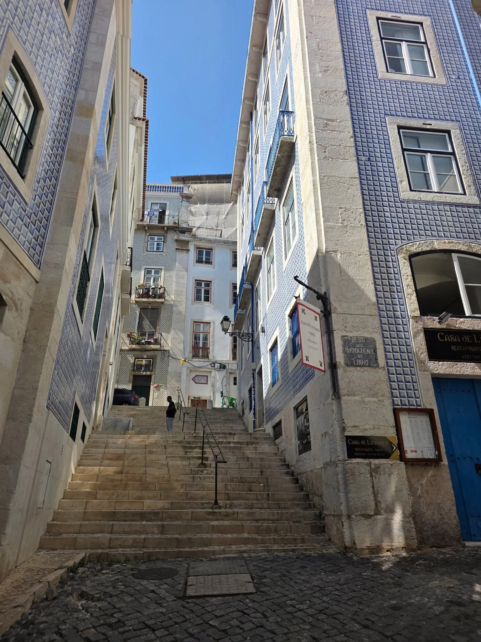 Flight of stairs between two buildings in Lisbon, Portugal