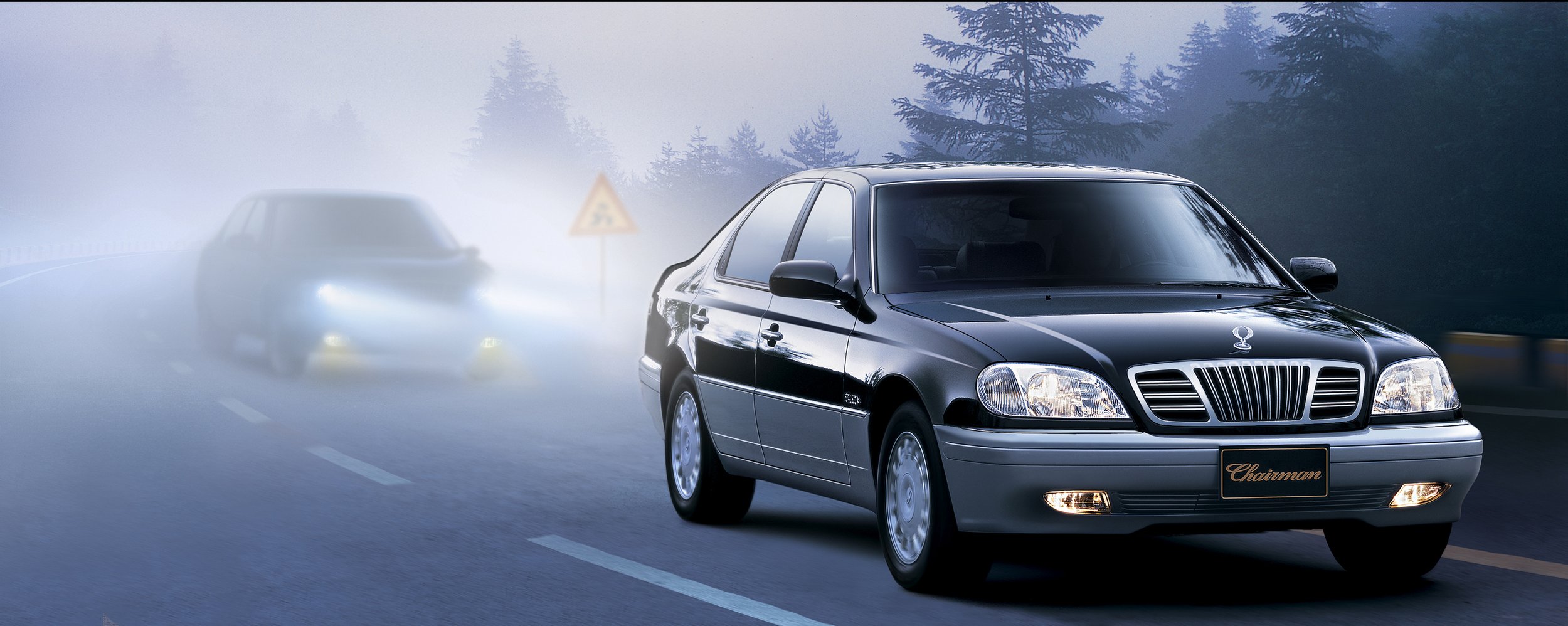 ssangyong-chairman-2000s-driving-front-quarter-black-fog-01.jpg