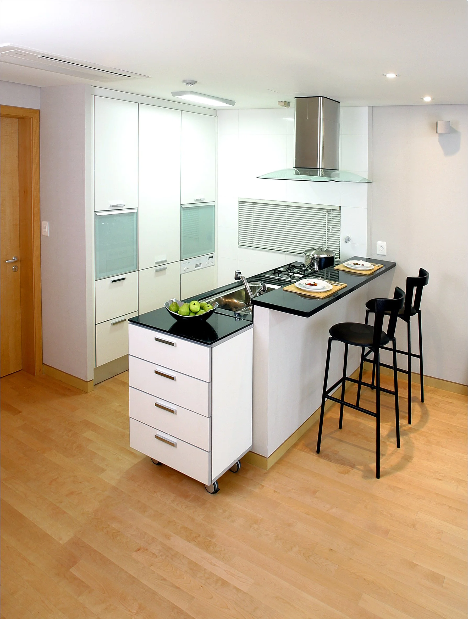 deau-kitchen-interior-island-bar-black-countertop-white-cabinet-wood-floor-perspective-01.jpg